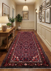 Oriental hand-knotted Persian wool runner rug in a classic traditional living room