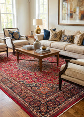 Oriental hand-knotted Persian wool rug in a classic traditional living room