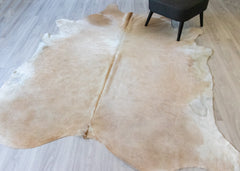 light gold cowhide rug
