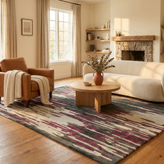 Living room with a patterned rug, brown armchair, white sofa, and wooden coffee table.